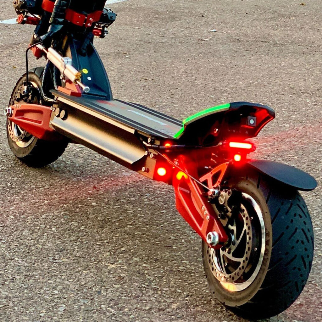 Dualtron Thunder electric scooter with rear lights on.
