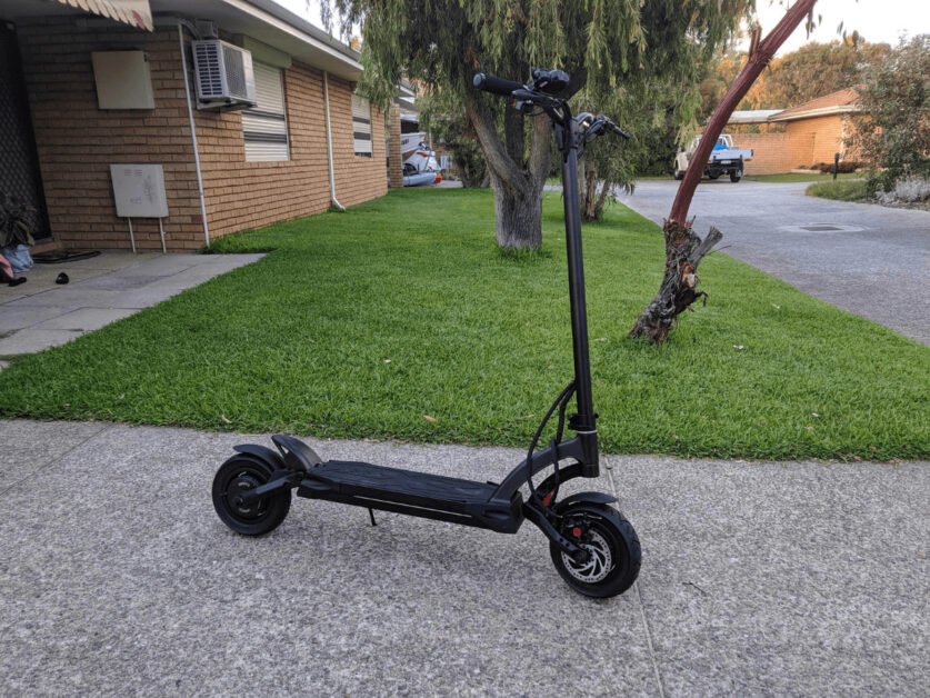 Kaabo Mantis Pro standing on the road in front of the house.