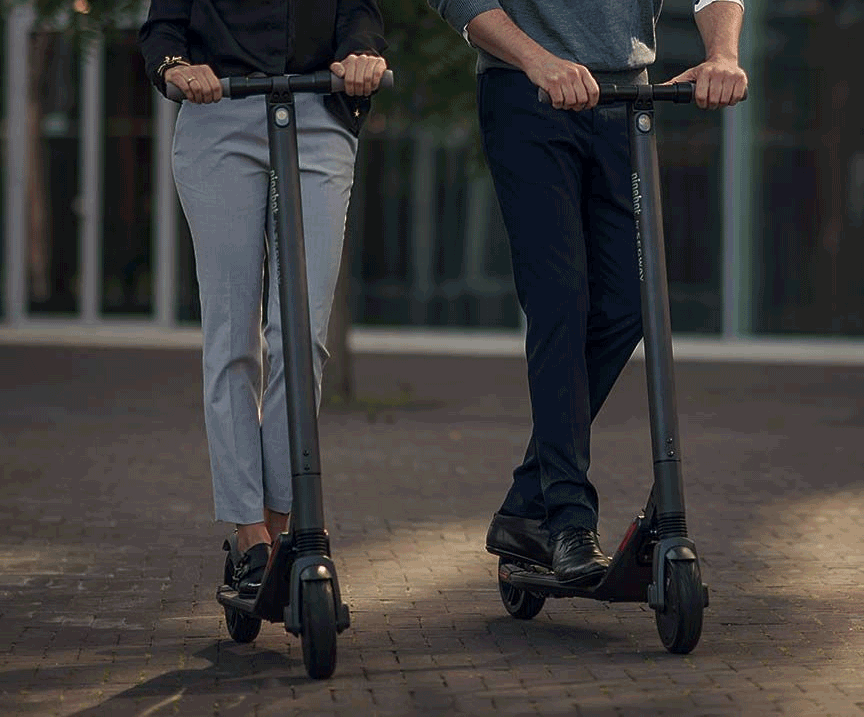 people riding with segway ninebot es 2 e-scooters