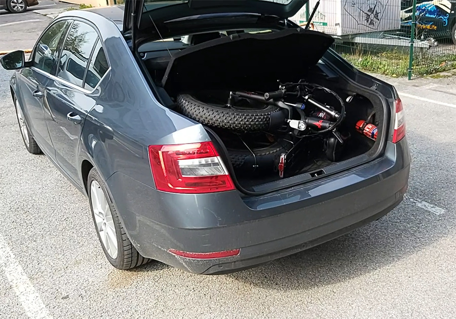 Folding fat tire electric bike Engwe ep-2 pro in the trunk of a sedan car