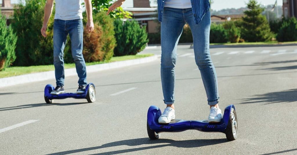 man and woman are riding with off road hoverboards while having a lot of fun