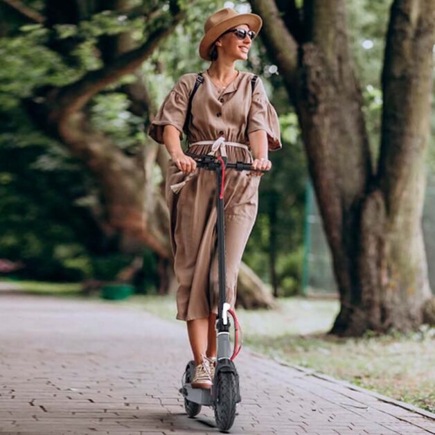 An elegant lady is riding with Hiboy S2 electric scooter