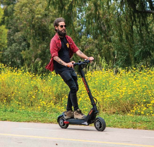 A man riding with Inokim OxO electric scooter.