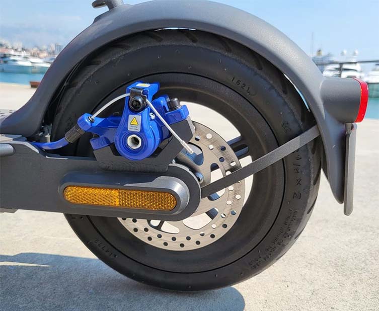 rear tire and brake system of an electric scooter
