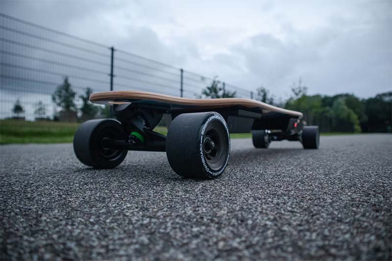 trucks and wheels of an electric longboard