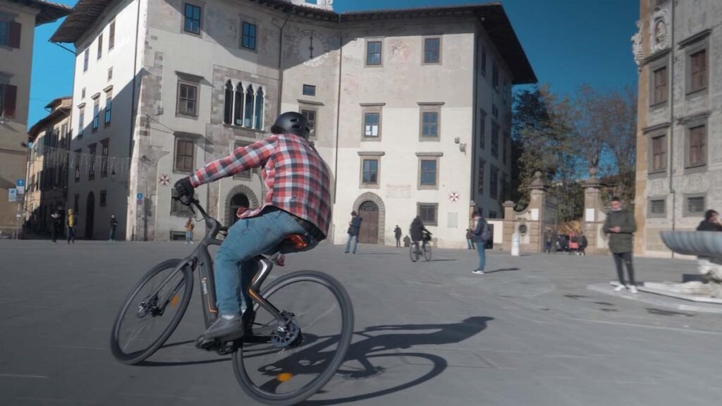 A man is taking a corner with Urtopia e-bike.