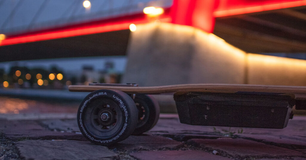 close photo of the electric skateboard in the dark