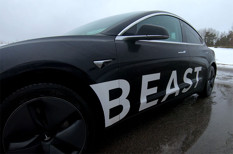 Tesla Model 3 Long Range with the sticker 'Beast' on the side of it.