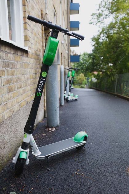 Lime electric scooter standing on the street