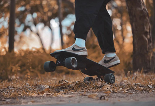 skateboarder jumps with a Meepo Mini 2