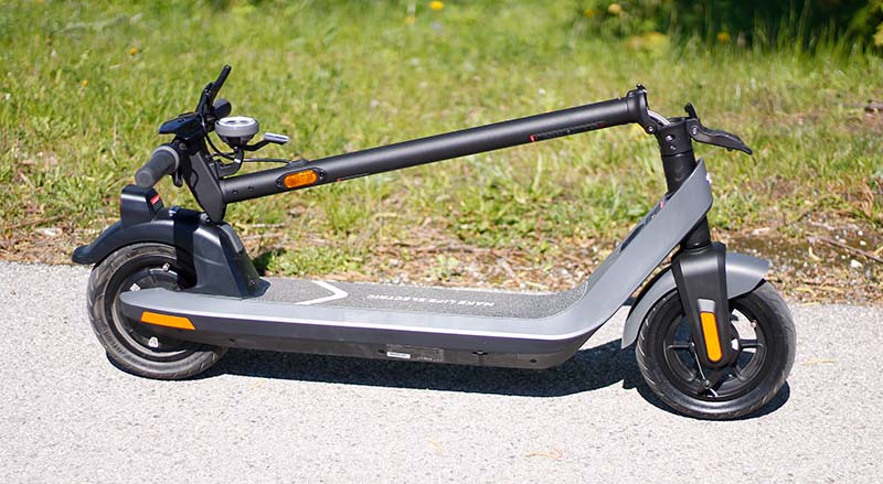 NIU KQi2 electric scooter folded down into the most compact size.