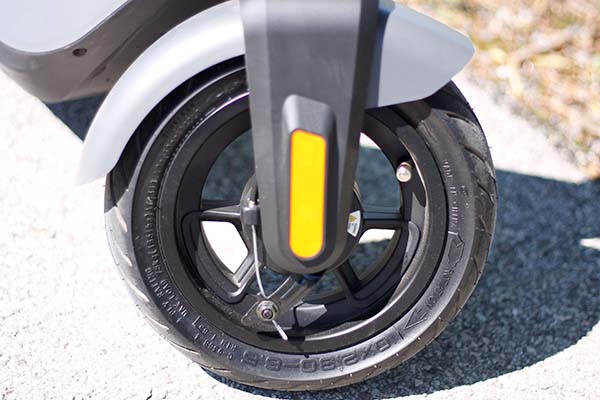 the 10-inch front wheel of an electric scooter