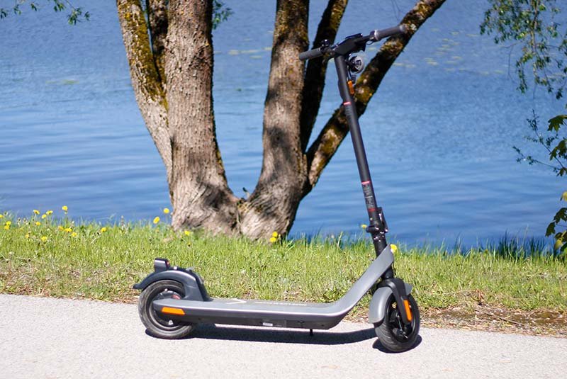 niu kqi2 pro electric scooter waiting to be taken into garage