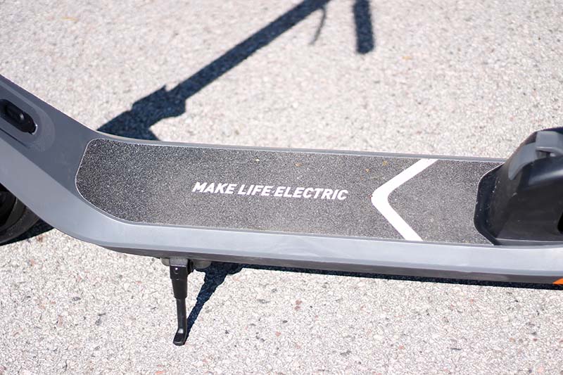 a close shot of a deck of an electric scooter