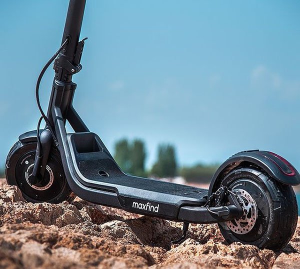 maxfind glider electric scooter on the rocky surface