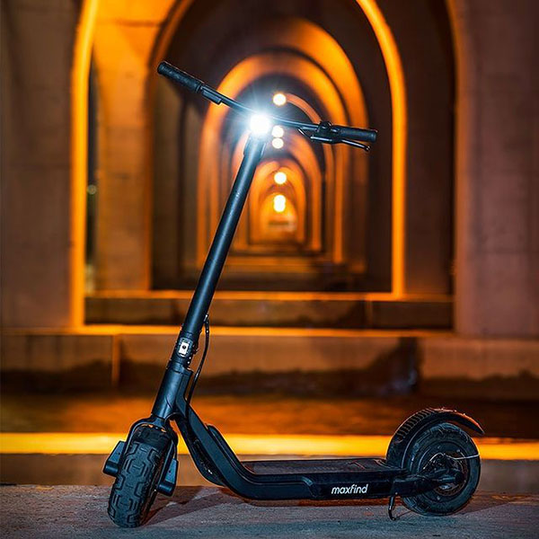 maxfind glider electric scooter in the dark with the light on