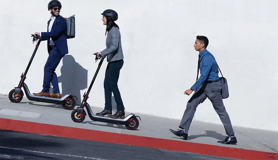 Man and woman climbing an incline with Niu KQi3 Max.