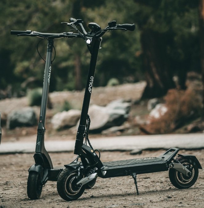 2 apollo electric scooters next to each other