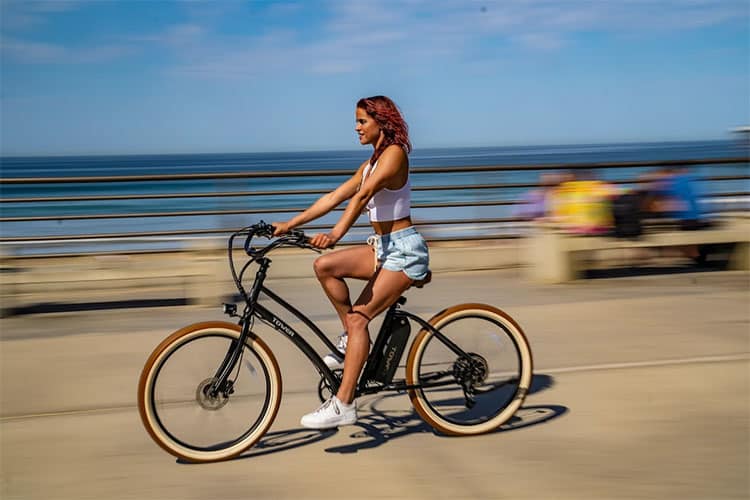 young woman cruising around with electric bike