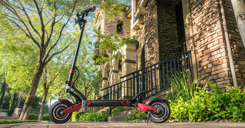 high-quality electric scooter in front of the big house