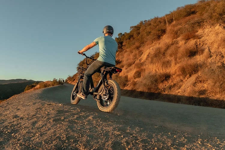 man riding electric bike on off road track