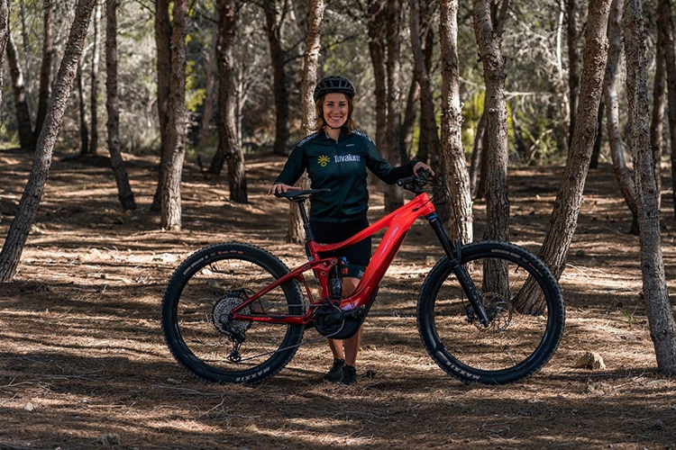 woman with red electric mountain bike