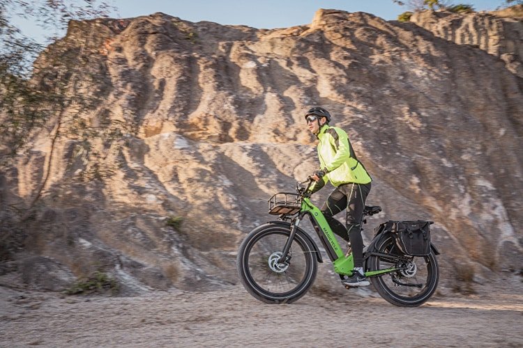 man riding magicycle deer ebike on a rough terrain