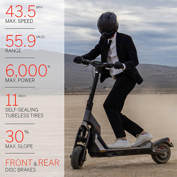 man in a suit riding with segway gt2 in a desert