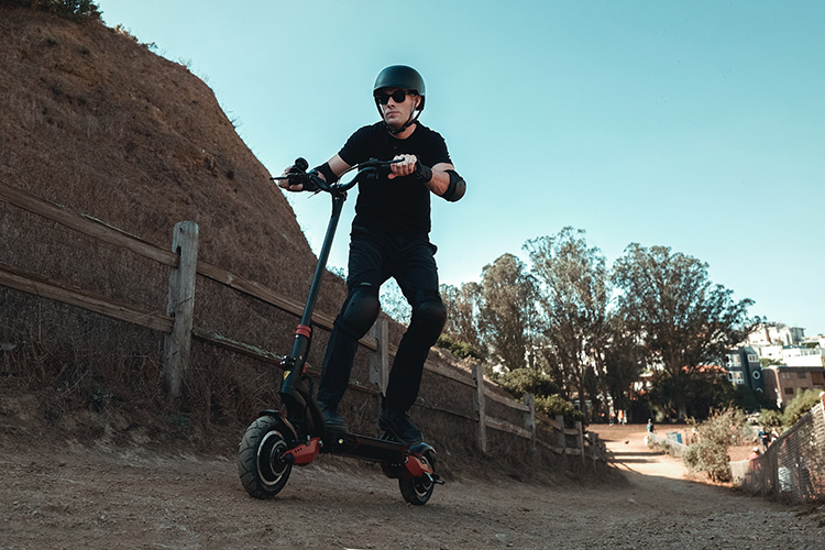 man on an off-road track with powerful electric scooter