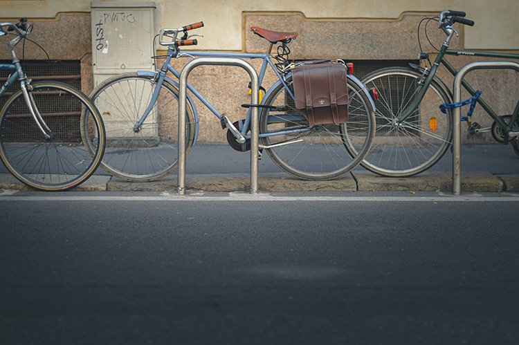 one bike is locked with u-lock and another is locked with chain lock