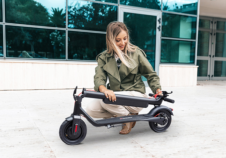 woman folding the electric scooter