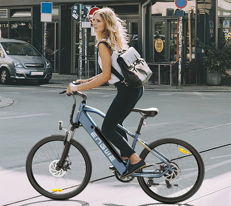 woman rides engwe p26 commuter bike on the urban area