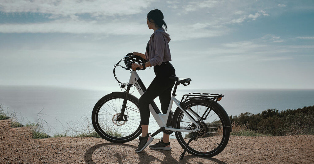 fit woman riding an electric bike