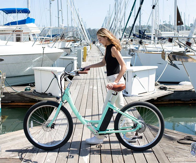 girl standing next to her Blix Sol ebike