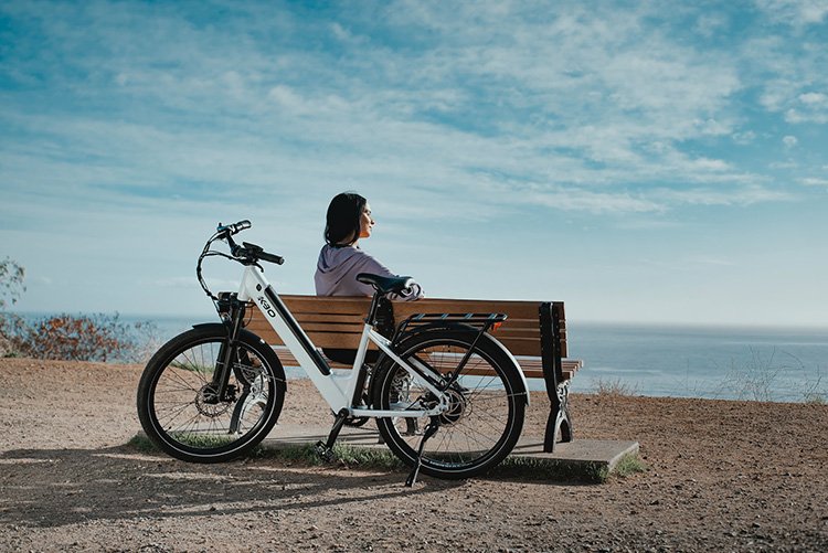 step-through electric bike behind the bench