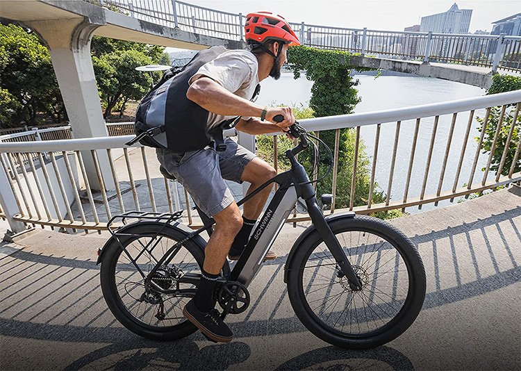 man riding uphill with Schwinn electric bike