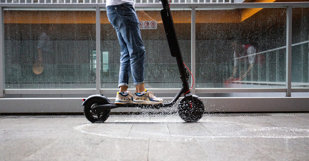 electric scooter riding in the rain