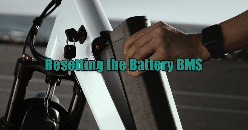 man removes the ebike battery to reset the BMS
