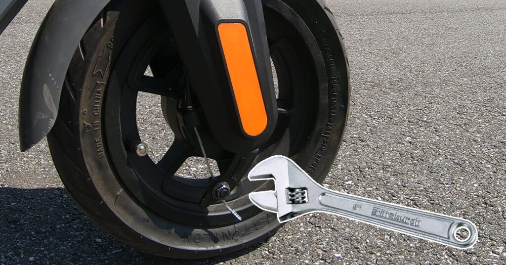 adjusting electric scooter drum brakes with a wrench