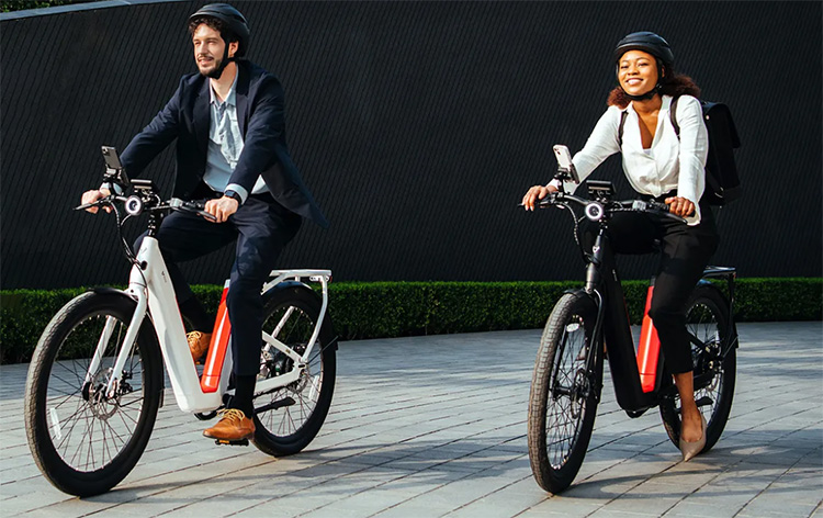 man and woman riding with NIU electric bicycle