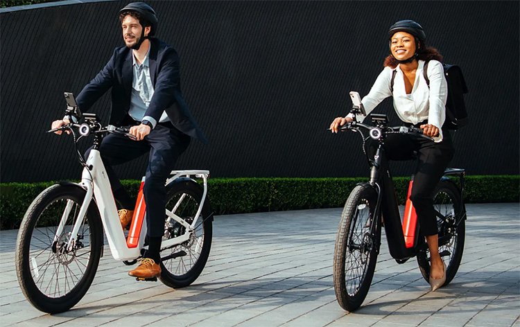 man and woman riding with NIU electric bicycle