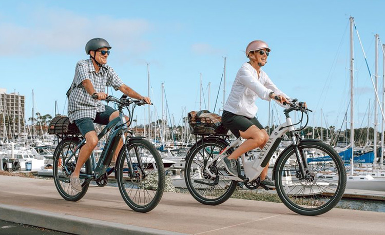 man and woman riding with aventon electric bikes