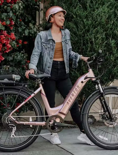 woman laughing next to the aventon level ebike