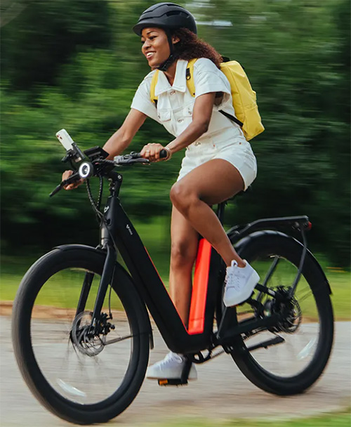 woman riding with niu ebike