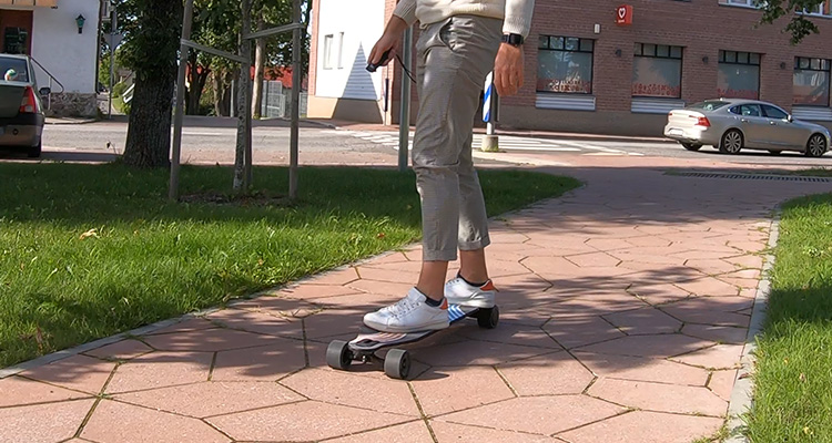 man rides a gpad blade electric skateboard