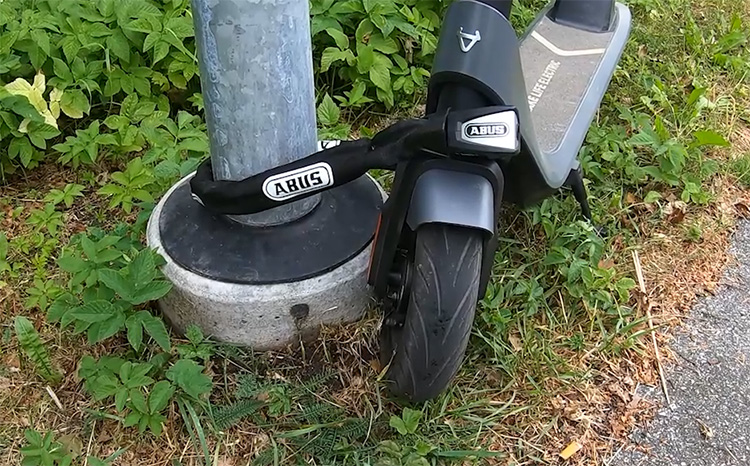electric scooter locked with a chain lock