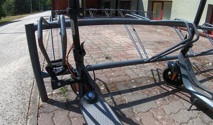 electric scooters attached to the bike rack