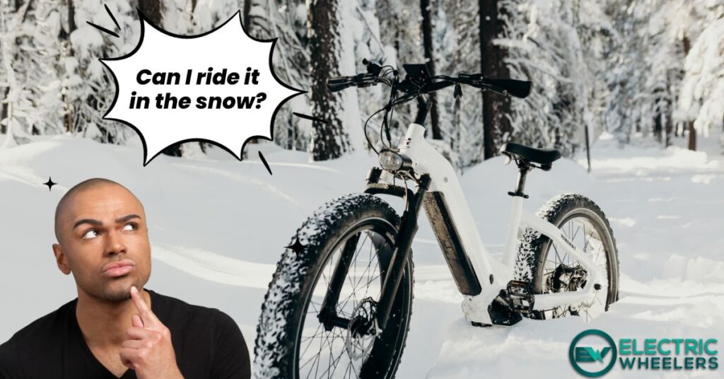 man is looking an electric bike in the snow and thinking if it is okay to ride it in the winter