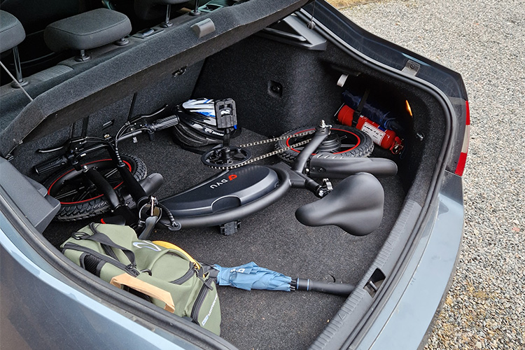 small ebike in the trunk of the car